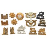 6 pairs collar badges: Queen’s with title scroll, brass and blackened; R Warwicks bear and staff;