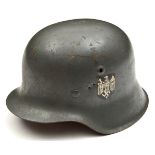 A German M42 style steel helmet, the grey painted skull with single third reich army decal but