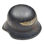 A Third Reich Luftschutz 2 piece steel “gladiator” helmet, with transfer badge to the front, printed