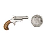A similar model of a .41” Colt No 3 derringer pistol, 2-1/8” overall, with bright steel finish and
