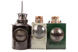 3 LMS/SR Railway lamps. A LMS black painted lamp marked ‘The Adlake Non Sweating Lamp’, bracket to