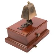 A railway signal box block bell. An example in a mahogany case with a squared-off brass cow-bell