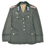 A Third Reich style Army Medical officer’s 4 pocket tunic, the added insignia comprise epaulettes,