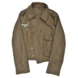 A Third Reich style olive green Panzer type single breasted single pocket jacket, with brown