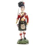 A well modelled painted Sitzendorf porcelain figure “Seaforth Highlanders 1815”, officer in full