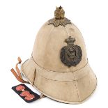 A rare sealed pattern khaki tropical helmet brass acanthus plume mount with Victorian crowned