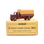 A Dinky Toys Trade Box of Austin Covered Wagon 30S. Containing one later example (413) in maroon
