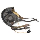 A WWII German leather flying helmet, with earphones, throat microphones, and cable with plug. GC (