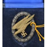 A Third Reich paratrooper’s badge, with WM wreath, brass eagle, wide hinge and round pin, the