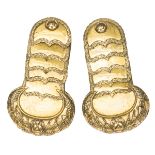 A pair of officer’s gilt shoulder scales of the 13th Light Dragoons, embossed trophies to crescents,