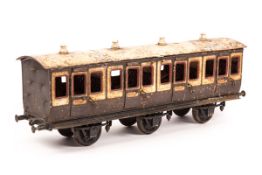 A Bing gauge 3 (2.5" gauge) tinplate 6-wheel suburban passenger coach. (1908-1925 period),