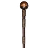 A Zulu polished darkwood knobkerry, almost spherical head, 6 closely wound copper wire, spiral