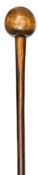 A Zulu polished wooden knobkerry, almost spherical head, flared end to staff, 26” overall. GC,