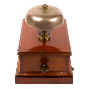 A railway signal box block bell. An example in a mahogany case with a mushroom shaped bell and