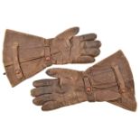A pair of Luftwaffe Pilot’s flying gloves, with maker’s mark and dated 1941, complete with straps.