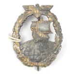 A Third Reich Auxiliary Cruiser badge, solid back integrally cast with “JMME-SOHN BERLIN”, with