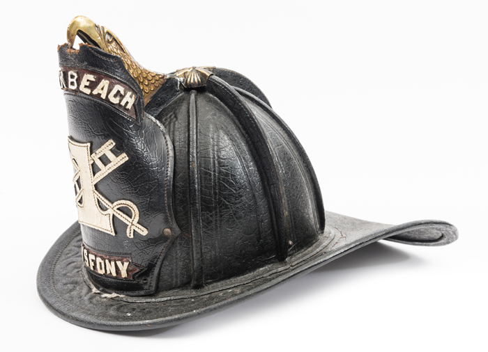 A late 19th century American helmet of the 1st North Beach V.S. Fire Dept. New York, of stout