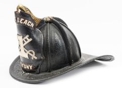 A late 19th century American helmet of the 1st North Beach V.S. Fire Dept. New York, of stout