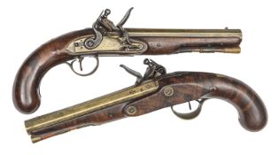 A pair of 26 bore brass barrelled flintlock holster pistols of a type favoured by naval officers, by