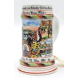 An Imperial German ½ litre porcelain beer stein, the polychrome decoration depicting scenes from