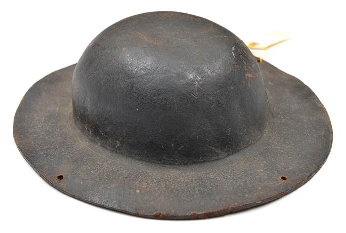 An interesting Cornish tin miner’s stout brown leather hat, in the style of an army tin helmet,