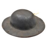 An interesting Cornish tin miner’s stout brown leather hat, in the style of an army tin helmet,