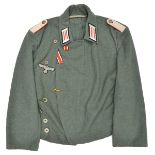 A Third Reich style grey/green Panzer style single breasted jacket, with grey composition buttons,