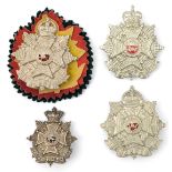 4 Border Regt cap badges, Vic (brooch pin), large KC (2), one on black/red/yellow rosette, and