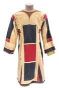 A 19th century Sudanese tunic jibbah, of coarse white linen applied all over with blue and red