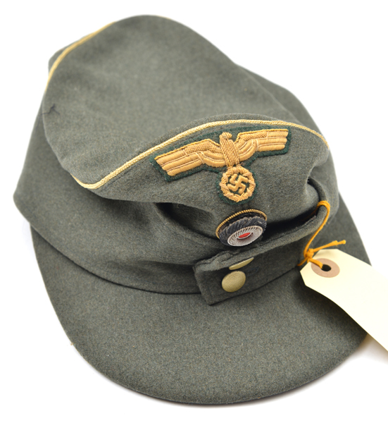 A Third Reich style officer’s field grey ski cap, with bullion cockade, buff eagle and yellow