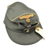 A Third Reich style officer’s field grey ski cap, with bullion cockade, buff eagle and yellow