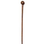 A Zulu polished wooden knobkerry/staff, slightly flattened small head, flared end to staff, 37”