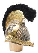 A Hanoverian cavalry officer’s gilt helmet, c 1825, the skull with applied acanthus leaves to the