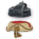 A grey faux fur hat, with quilted lining rubber stamped “1943/WH” and serial number; and a