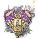 A heart shaped pin cushion with inset silk portrait of Maj Gen Wauchope, killed in action at