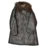 A German three quarter length black leather coat, with brown fur collar, black composition buttons