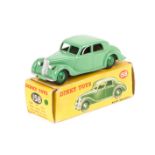 A Dinky Toys Riley Saloon (158). In light green with mid green wheels. Boxed, some wear. Vehicle