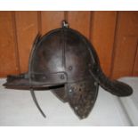A lobster tail helmet in the style of the mid 17th century, the 2 piece ribbed skull with suspension
