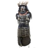 A suit of Japanese armour, comprising kabuto, the skull composed of 25 ribbed segments, with peak,