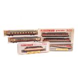 9 N gauge locomotives and coaches by Fleischmann, Minitrix and Lima. A DB 3 car diesel multiple unit