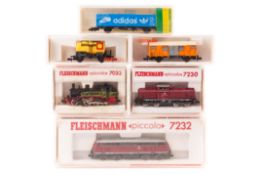 13 N gauge including locomotives and freight rolling stock by Fleischmann and Minitrix. 3
