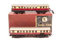 A Trix OO Scale Model Diesel Flier 20/58. A two-coach unit with lights in maroon and cream German DB