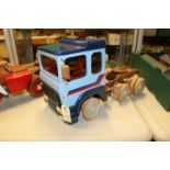 A wooden hand-made forward control ERF E10 Series 8-wheel Tractor Unit in iroko and beech. The model