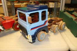 A wooden hand-made forward control ERF E10 Series 8-wheel Tractor Unit in iroko and beech. The model