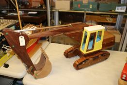 A wooden hand-made JCB/CAT style tracked excavator. An impressive model finished in iroko and beech,