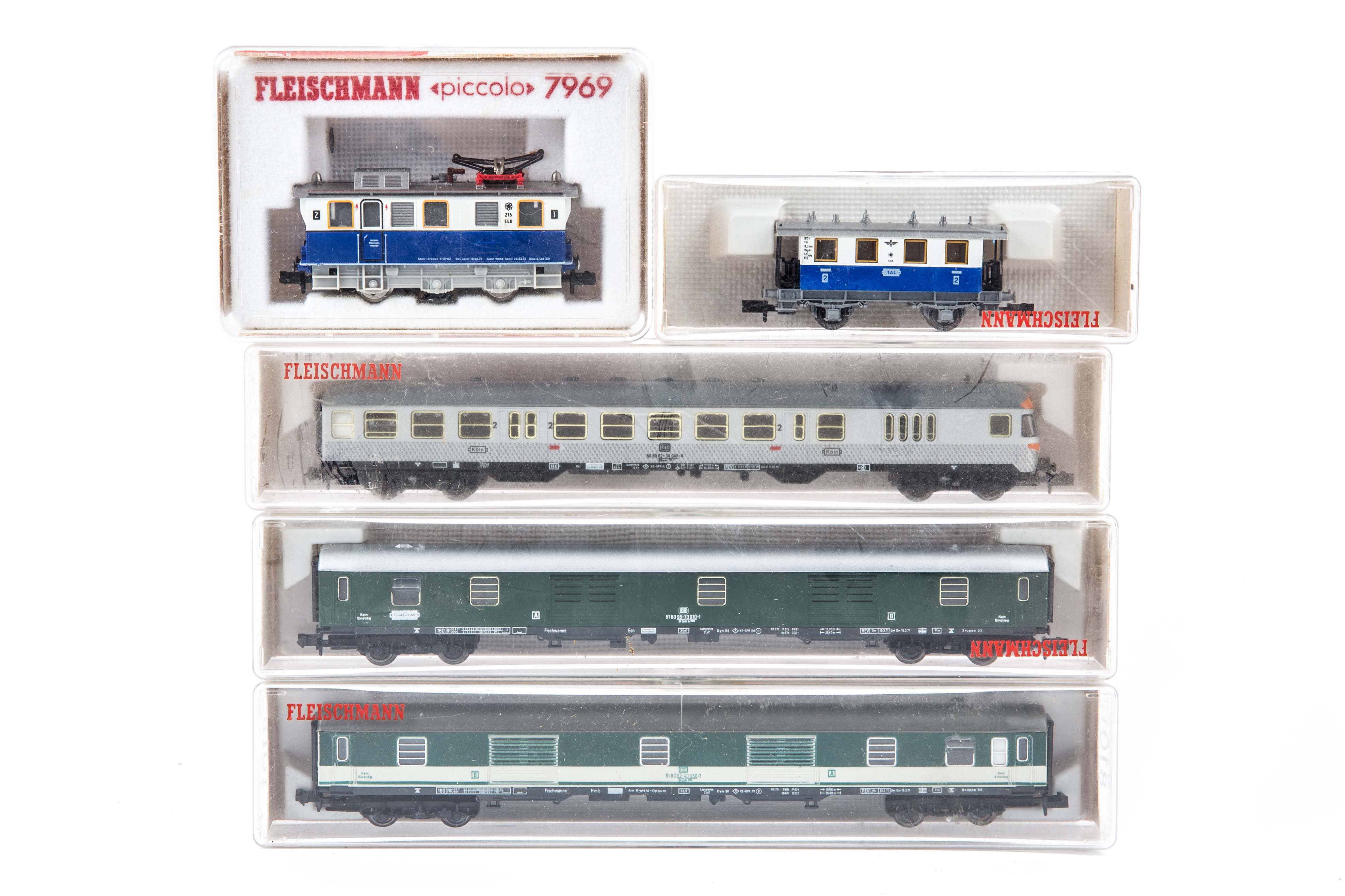 9 N gauge locomotives and coaches by Fleischmann and Minitrix. A Swiss SBB-CFF Bo-Bo electric