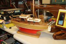 A wooden 1960’s/70’s style hand-made single masted yacht. An example with tiered closed cabin fitted