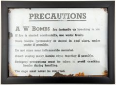 A black on white enamelled warning plaque, taken from the lid of an ammunition box, inscribed “