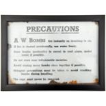 A black on white enamelled warning plaque, taken from the lid of an ammunition box, inscribed “