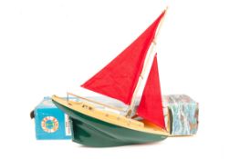 A 1960’s Scalex Boats Ocean Racing Yacht. ‘Diana’ (16in. 41cm). A plastic pond yacht with dark green